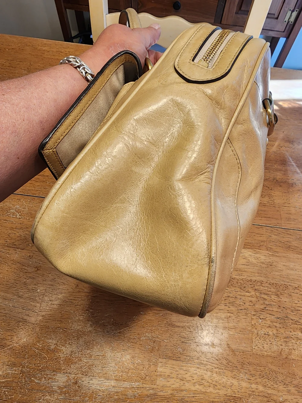 2011 Coach Poppy Push Lock Satchel features a beige leather exterior
